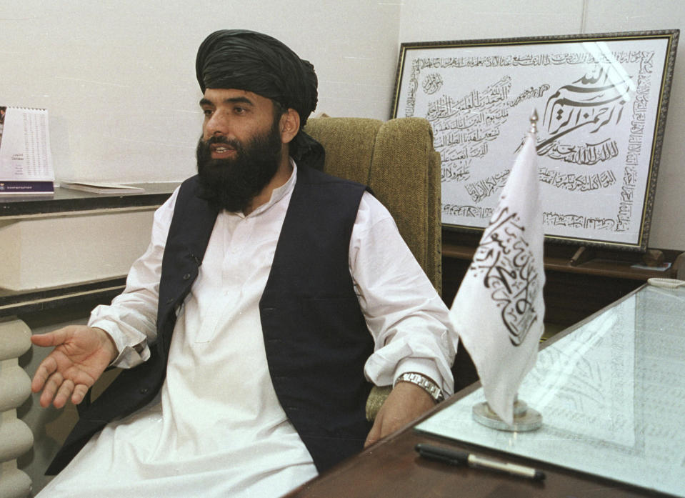 FILE - In this Nov. 14, 2001 file photo, Suhail Shaheen, then Deputy ambassador of the Islamic Republic of Afghanistan, gives an interview in Islamabad, Pakistan. The Taliban spokesman says the seventh and latest round of peace talks with the U.S. is "critical," as the militant group meets with Washington's envoy Zalmay Khalilzad in the Mideastern state of Qatar, where it maintains a political office. (AP Photo/Tariq Aziz, File)