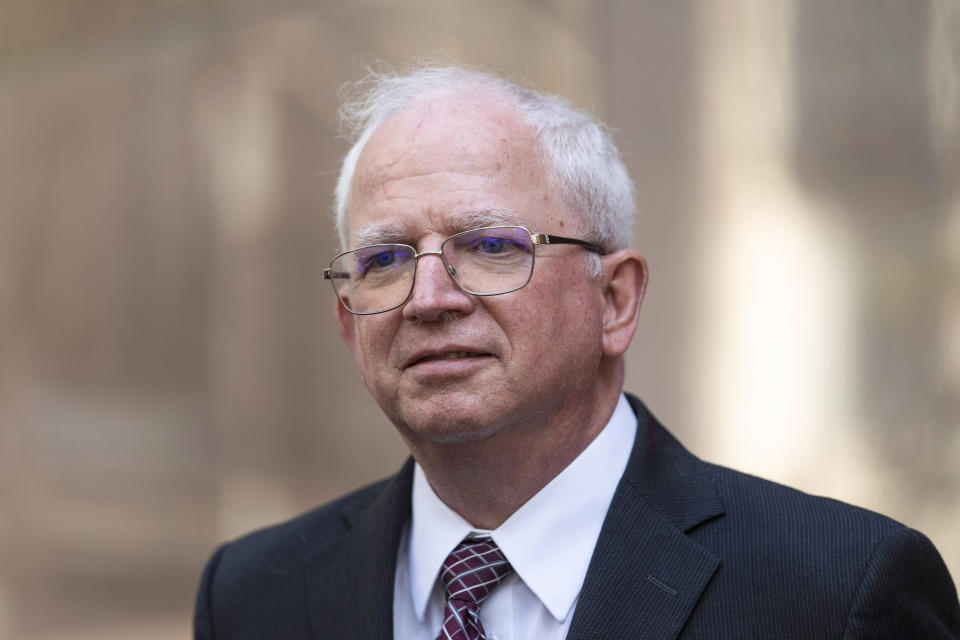 FILE - Attorney John Eastman, the architect of a legal strategy aimed at keeping former President Donald Trump in power, talks to reporters after a hearing in Los Angeles, June 20, 2023. Eastman has turned himself in to authorities on charges in the Georgia case alleging an illegal plot to overturn the then-president’s 2020 election loss. Eastman was booked at the Fulton County jail on Tuesday, Aug. 22 before being released by authorities. Eastman is expected to face a judge to be arraigned in the sprawling racketeering case. (AP Photo/Jae C. Hong, File)