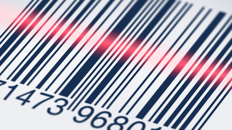 Barcode with the red line of a scanner light across it