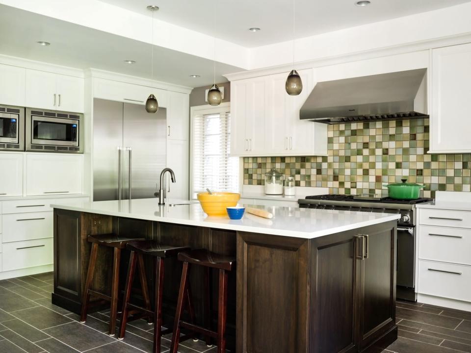 Countertops with Bowls on Them and Green Tile Backsplash