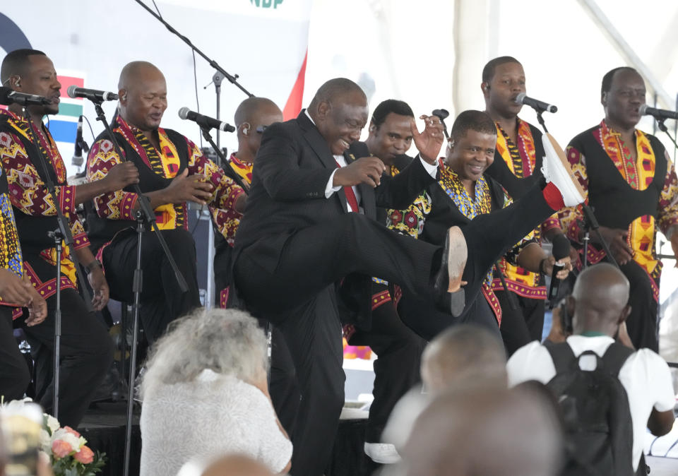 FILE - South African President Cyril Ramaphosa, centre, dances to music as he attends Freedom Day celebrations in Pretoria, South Africa, on April 27, 2024. Ramaphosa has tried to rebuild the reputation of the ANC by cracking down on government graft, but unemployment has risen to 32% under him and he has struggled to curb poverty. (AP Photo/Themba Hadebe, File)