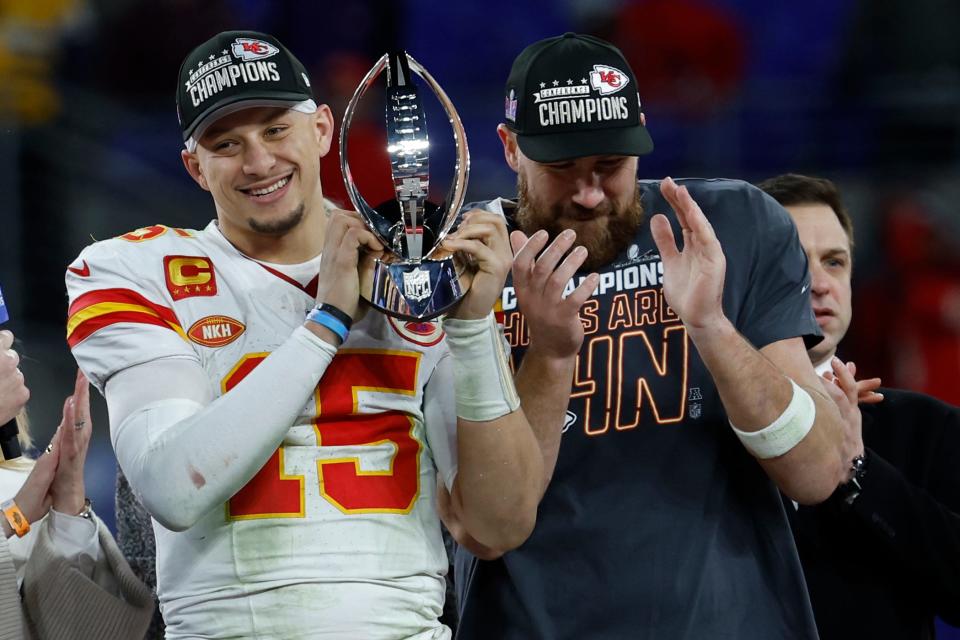 Kansas City Chiefs quarterback Patrick Mahomes (15) celebrates with the Lamar Hunt trophy next to Chiefs tight end Travis Kelce (R) after the Chiefs' game against the Baltimore Ravens in the AFC Championship football game at M&T Bank Stadium.