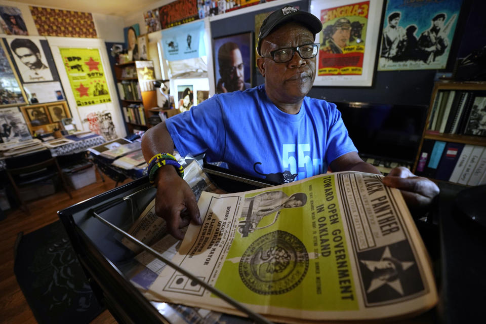 Bill Jennings displays a 1972 edition of the Black Panther newspaper with a photo of Black Panther co-founder Bobby Seale on the front page, at his home in Sacramento, Calif., Wednesday, Sept. 29, 2021. Jennings was 17 when he joined the Black Panthers in 1968 and has been collecting memorabilia for more than 20 years to create the archives. (AP Photo/Rich Pedroncelli)