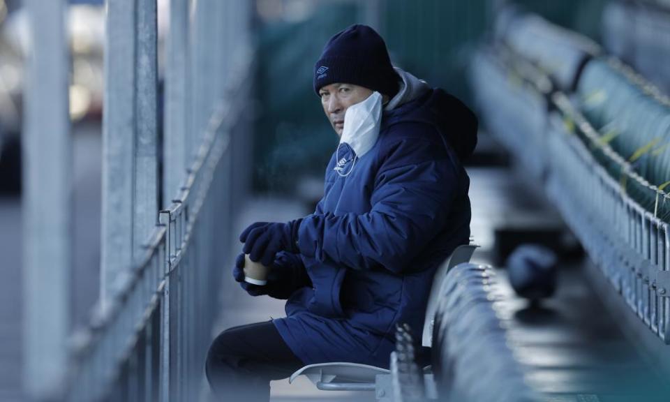 Eddie Jones, the England head coach, looks on during the match between Ealing Trailfinders and Saracens.