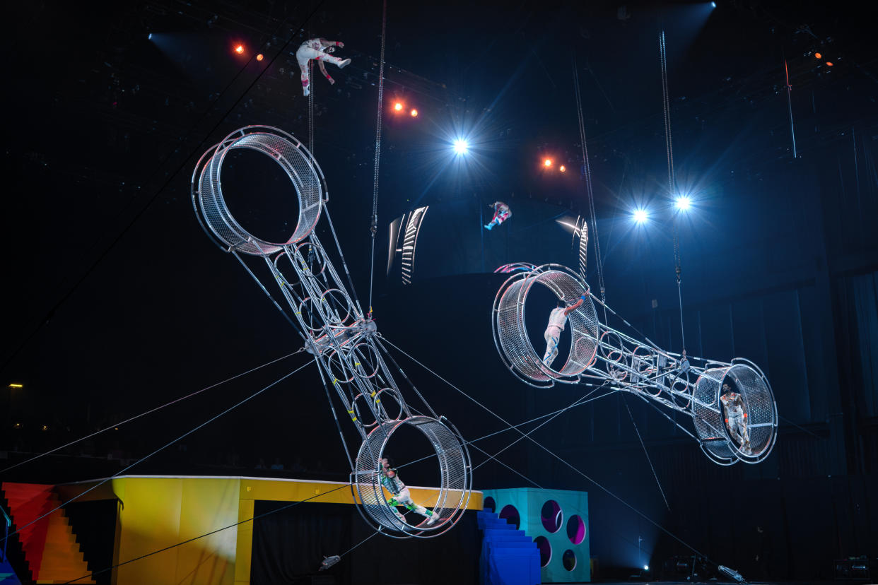 Four acrobatic performers power the Double Wheel of Destiny, two side-by-side wheels that rotate independently at epic speeds and hang at 30-feet above the ground. (Courtesy Feld Entertainment)