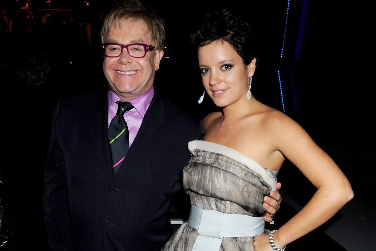 <p>Dave M. Benett/Getty</p> Elton John and Lily Allen in London in September 2008