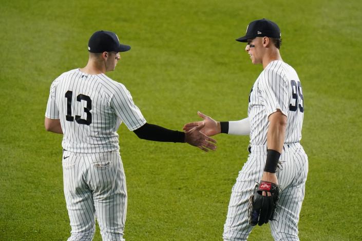 New York Yankees' Joey Gallo (13) celebrates with Aaron Judge (99) after a baseball game against the Los Angeles Angels Tuesday, May 31, 2022, in New York. The Yankees won 9-1. (AP Photo/Frank Franklin II)