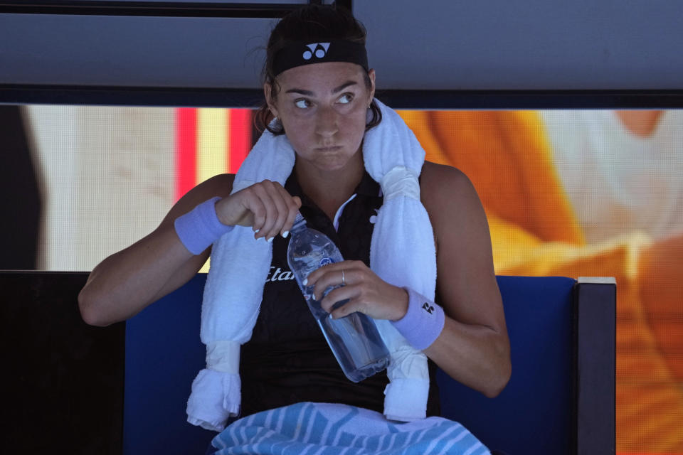 Caroline Garcia of France takes a drink her their fourth round match against Magda Linette of Poland at the Australian Open tennis championship in Melbourne, Australia, Monday, Jan. 23, 2023. (AP Photo/Aaron Favila)