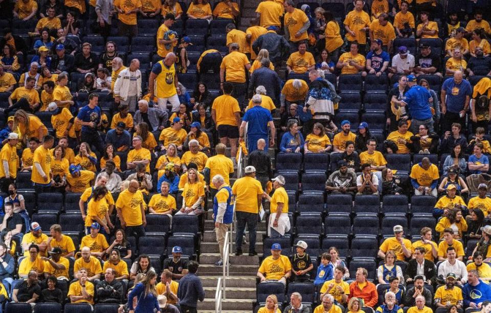 Golden State Warriors fans leave Chase Center in the fourth quarter as Game 6 is out of reach on Friday, April 28, 2023.