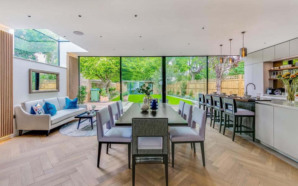 In the heart of Barnes village, this five-bedroom house has an open-plan living space, a bay-windowed room and a garden studio. It is £3.95m with Savills