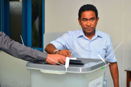 Maldives President Abdulla Yameen casts his vote at a polling station during the presidential election in Male, Maldives September 23, 2018. President Media//Handout via REUTERS.