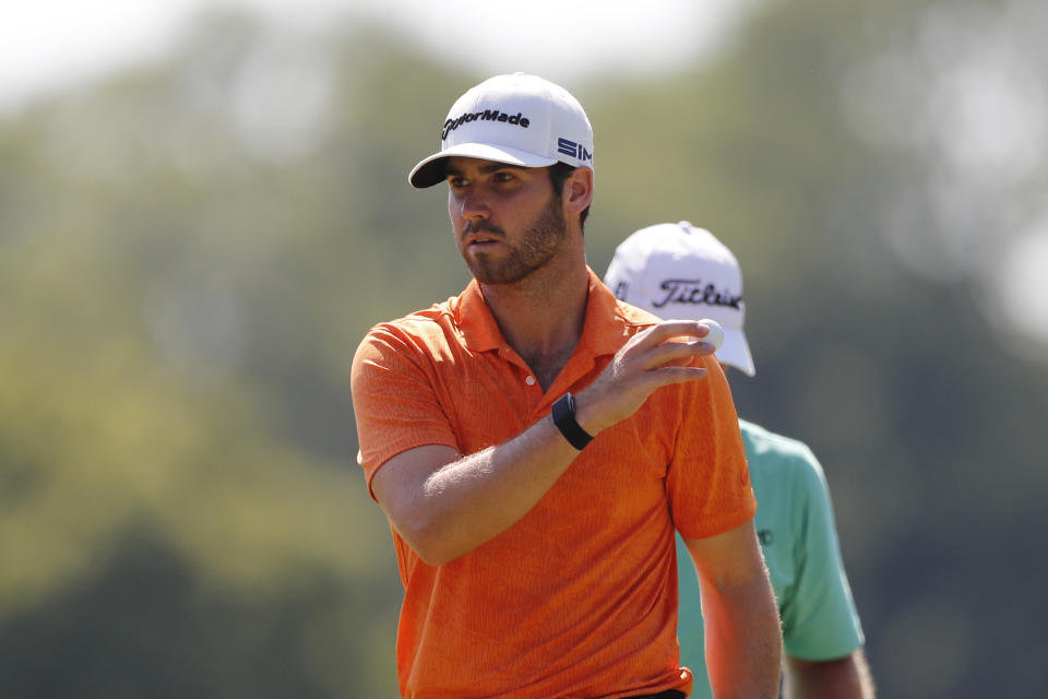 Matthew Wolff acknowledges his putt on the 11th green during the final round of the Rocket Mortgage Classic golf tournament, Sunday, July 5, 2020, at Detroit Golf Club in Detroit. (AP Photo/Carlos Osorio)