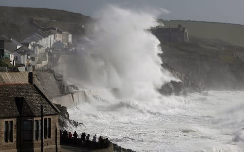 Huge waves whipped up by Hurricane Ophelia batter the coast at Porthleven in Cornwall - Credit: APEX