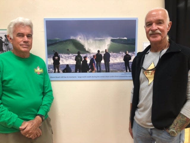 John Hughes, left, Executive Director of the Florida Surf Museum, and Bill Whiddon, who grew up surfing on South Beach, show how a north swell can affect surf conditions on a  traditionally small wave area like Miami Beach. The “Surfing Miami” exhibit at the Florida Surf Museum in Cocoa Beach is on display through March with a grand opening celebration from 7-9 p.m. on Dec. 11.