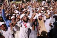 Supporters of several Islamist parties protest after Friday prayers in Dhaka, Bangladesh, Friday, Oct. 30, 2020. Thousands of Muslims and activists marched through streets and rallied across Bangladesh’s capital on Friday against the French president’s support of secular laws that deem caricatures of the Prophet Muhammad as protected under freedom of speech. (AP Photo/Mahmud Hossain Opu)