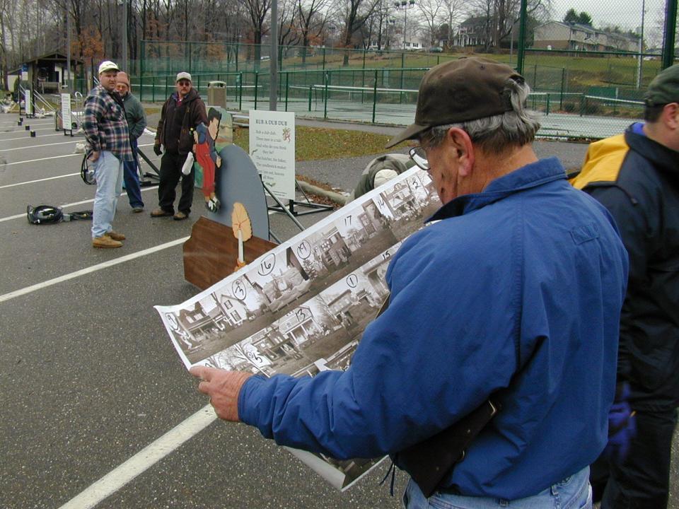 Dick Stewart looks over a diagram of where all of the Storybook Lane figures would be placed in Tuscora Park.