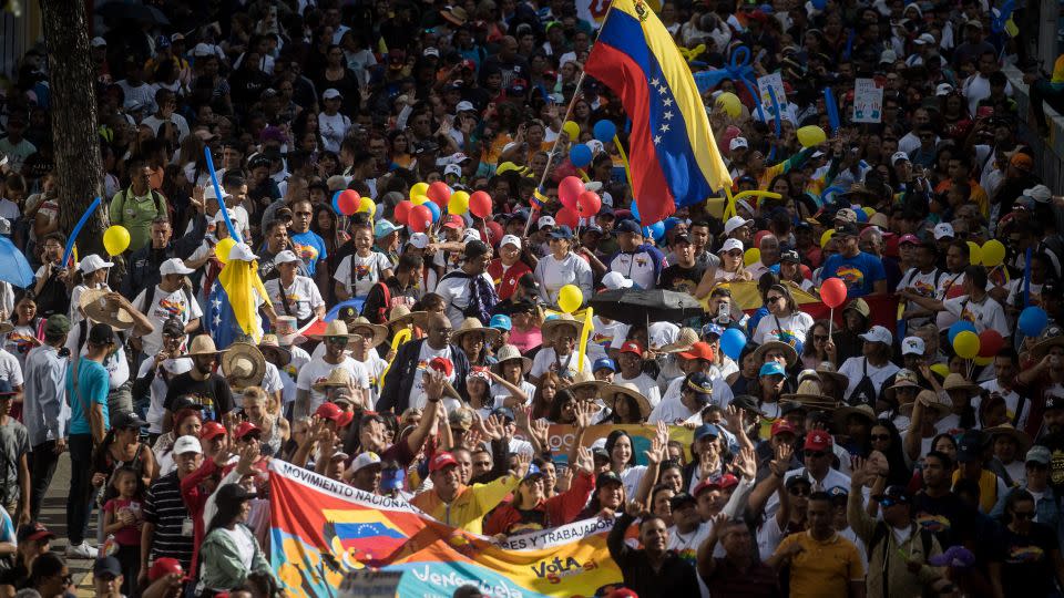 Venezuelans in Caracas take part in a rally during the closing of the campaign for the Essequibo referendum, on December 1. - Miguel Gutierrez/EPA-EFE/Shutterstock