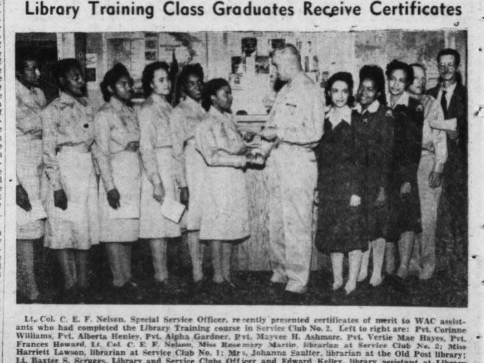 Staunton's Frances Howard, of the Women’s Army Corps, shakes the colonel’s hand.