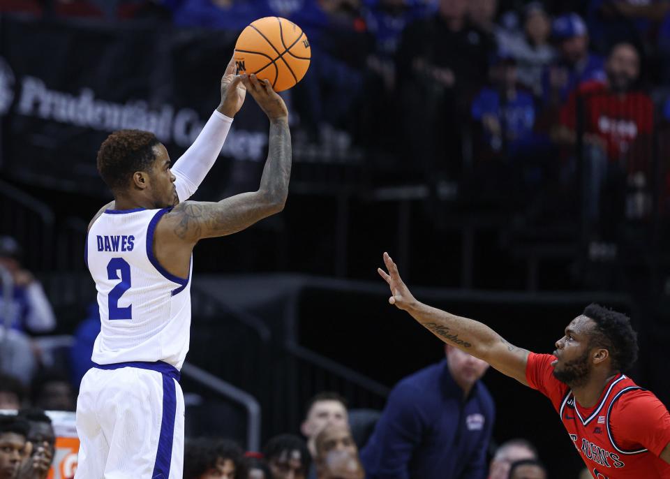 Seton Hall Pirates guard Al-Amir Dawes (2) shoots a three point basket during the first half as St. John's Red Storm guard Montez Mathis (10) defends at Prudential Center.