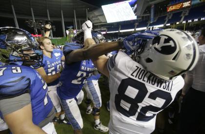 Players scuffle after Memphis defeated Brigham Young, 55-48 in double overtime during the inaugural Miami Beach Bowl football game, Monday, Dec. 22, 2014 in Miami. (AP Photo/Wilfredo Lee)