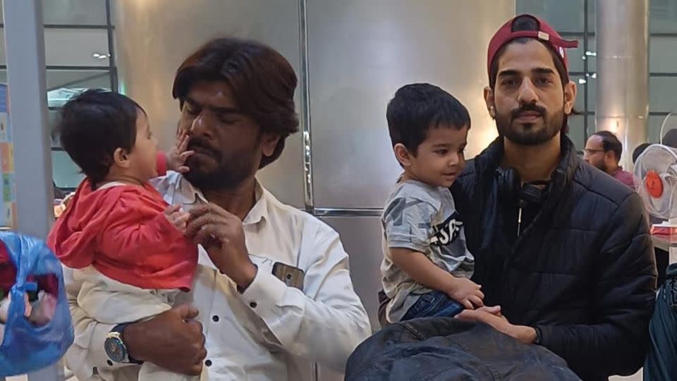 Asfran Mohammed, right, and his brother Imran are pictured with Asran's children before Asfran left for Russia. - Mohammed Imran