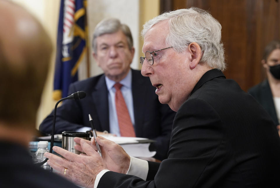 Senate Minority Leader Mitch McConnell of Ky., right, speaks as Sen. Roy Blunt, R-Mo., listens during a Senate Rules Committee hearing at the Capitol in Washington, Tuesday, May 11, 2021. (AP Photo/J. Scott Applewhite)