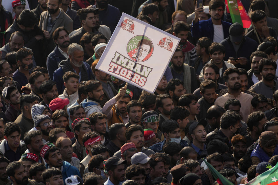 Supporters of Pakistan's former Prime Minister Imran Khan's 'Pakistan Tehreek-e-Insaf' party attend a rally, in Rawalpindi, Pakistan, Saturday, Nov. 26, 2022. Khan said Saturday his party was quitting the country's regional and national assemblies, as he made his first public appearance since being wounded in a gun attack earlier this month. (AP Photo/Anjum Naveed)