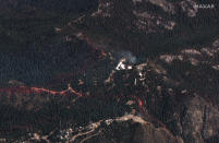 This natural color photo provided by Maxar Technologies shows a view of the Mount Wilson Observatory, center, near an area of the Bobcat Fire, Monday, Sept. 21, 2020, burning northeast of Los Angeles. (Satellite image ©2020 Maxar Technologies via AP)