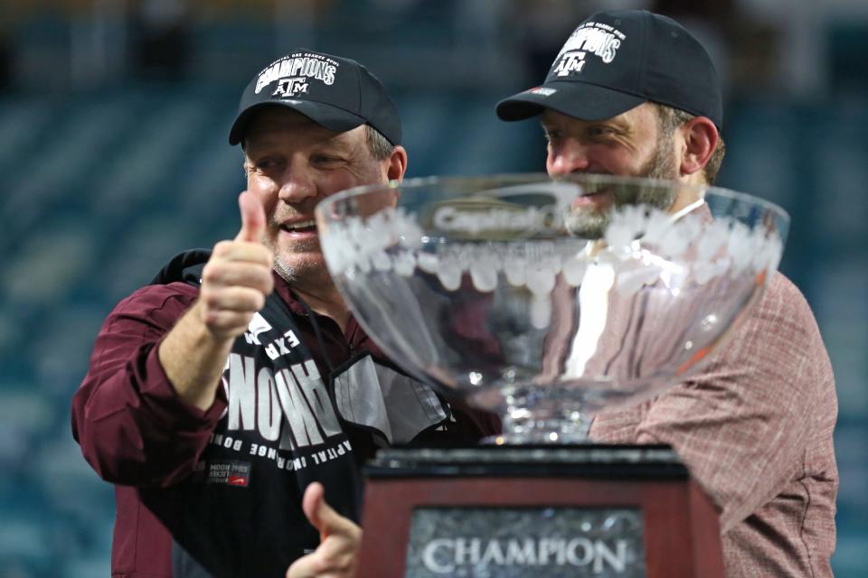 Jan 2, 2021; Miami Gardens, FL, USA; Texas A&M Aggies head coach Jimbo Fisher and Texas A&M Aggies Athletics Director Ross Bjork celebrate after winning the Orange Bowl against the North Carolina Tar Heels at Hard Rock Stadium. Mandatory Credit: Sam Navarro-USA TODAY Sports