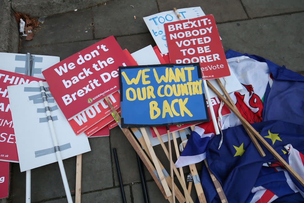 Brexit protestors placards lay on the ground near Parliament in London (Picture: PA)