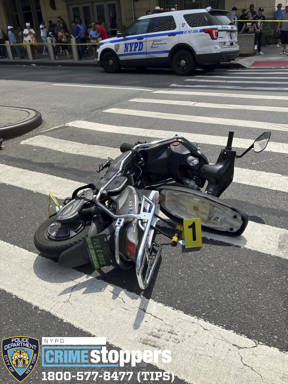 This photo provided by the New York City Police Department, Saturday, July 8, 2023, shows a motor scooter recovered at the scene of a shooting, in the Queens borough of New York. An 86-year-old New York City man was fatally shot and at least two others were seriously wounded by a man on a scooter who police say was shooting randomly at cars and pedestrians in Queens on Saturday. (New York City Police Department via AP)