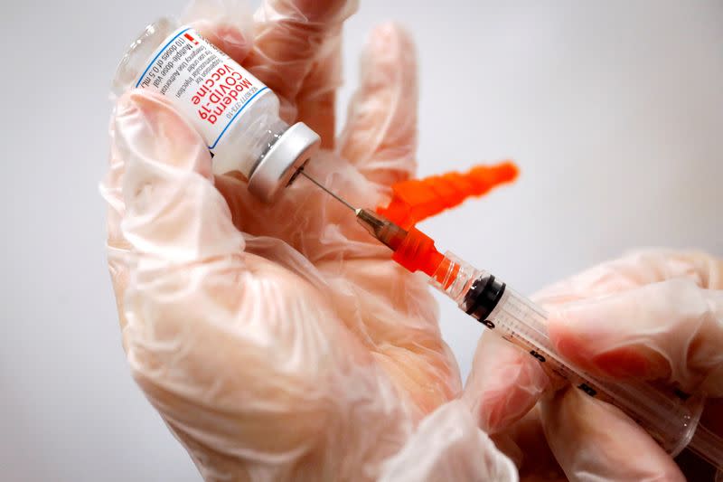 FILE PHOTO: A healthcare worker prepares a syringe with the Moderna COVID-19 vaccine at a pop-up vaccination site in Manhattan in New York City