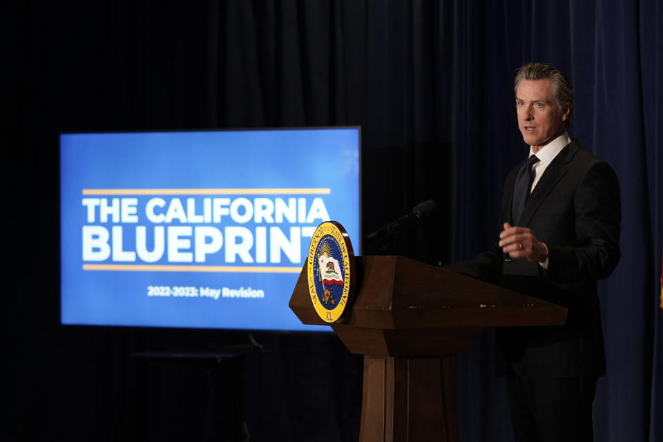 California Gov. Gavin Newsom unveils his 2022-2023 state budget revision during a news conference i in Sacramento, Calif., Friday, May 13, 2022. California is expected have a record surplus. (AP Photo/Rich Pedroncelli,)