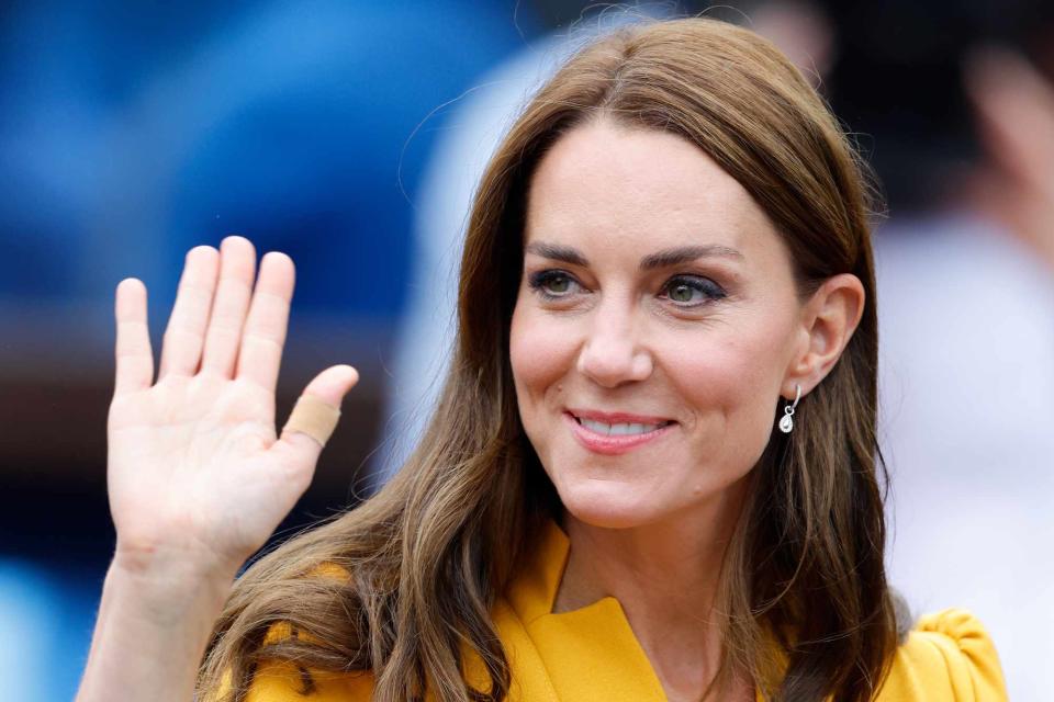 <p>Max Mumby/Indigo/Getty </p> Kate Middleton smiles during a visit to the Royal Surrey County Hospital