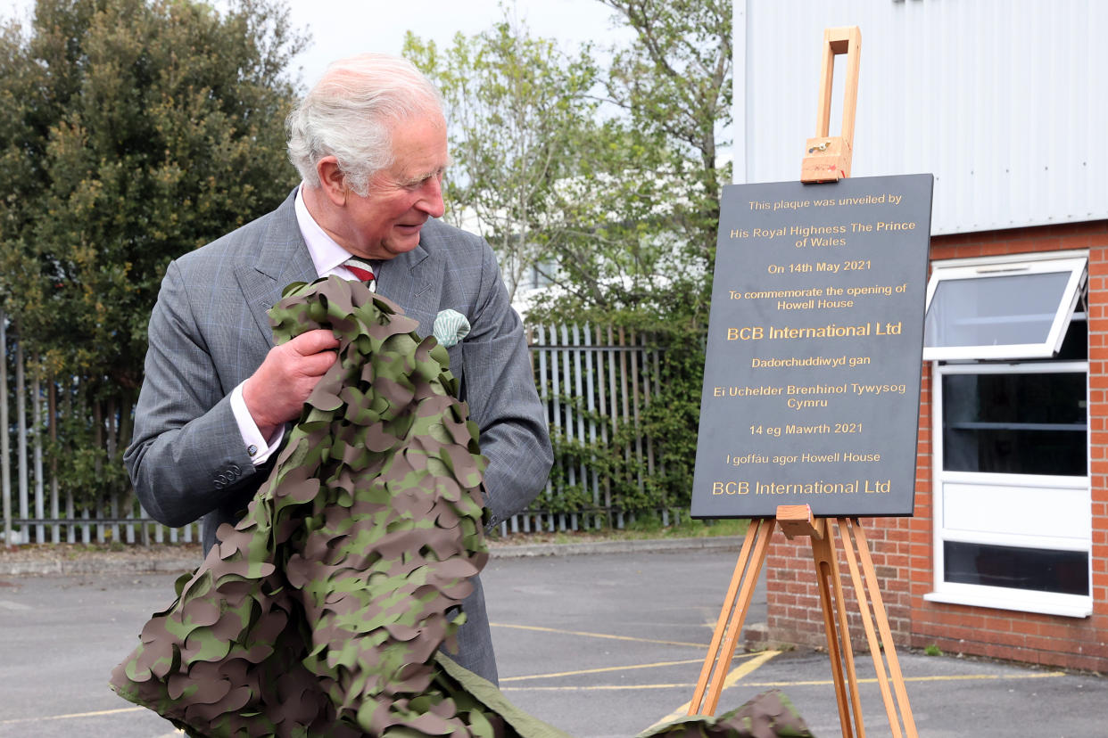 CARDIFF, UNITED KINGDOM - MAY 14: Prince Charles, Prince of Wales unveil a plaque to officially open the new headquarters of BCB at the end of his visit to the supplier of protective, medical and defence equipment, BCB International, on May 14, 2021 in Cardiff, United Kingdom. (Photo by Chris Jackson - WPA Pool/Getty Images)