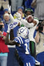 New York Jets' Bryce Hall (37) breaks up a pass intended for Indianapolis Colts' Zach Pascal (14) during the first half of an NFL football game, Thursday, Nov. 4, 2021, in Indianapolis. (AP Photo/Michael Conroy)