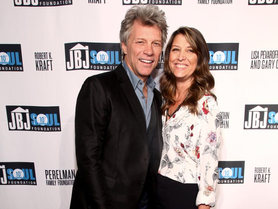 Jon and Dorothea smiling in front of a Soul Foundation backdrop.