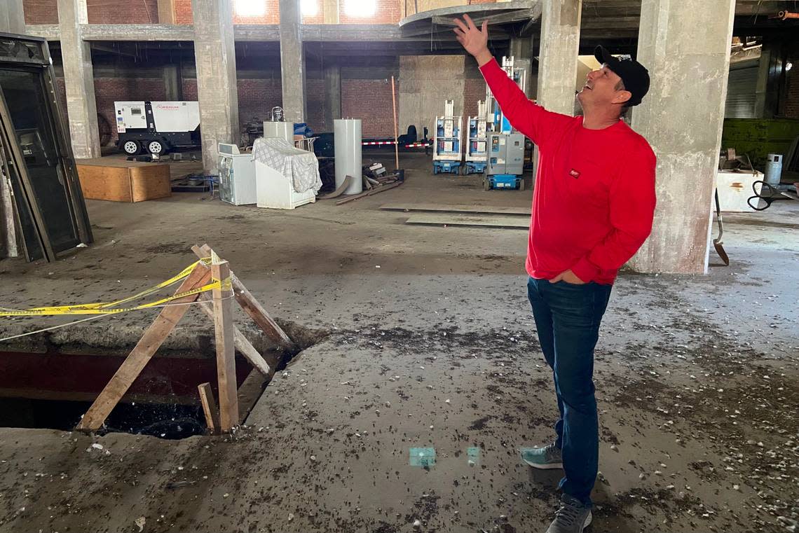 Will Dyck, president and CEO of Summa Development Group, gestures toward an empty space in the JC Penney building where a central elevator used to be. Dyck has submitted plans to transform Fresno’s oldest department store, vacant since the 1980s, into a 160-unit apartment building. MAREK WARSZAWSKI/marekw@fresnobee.com