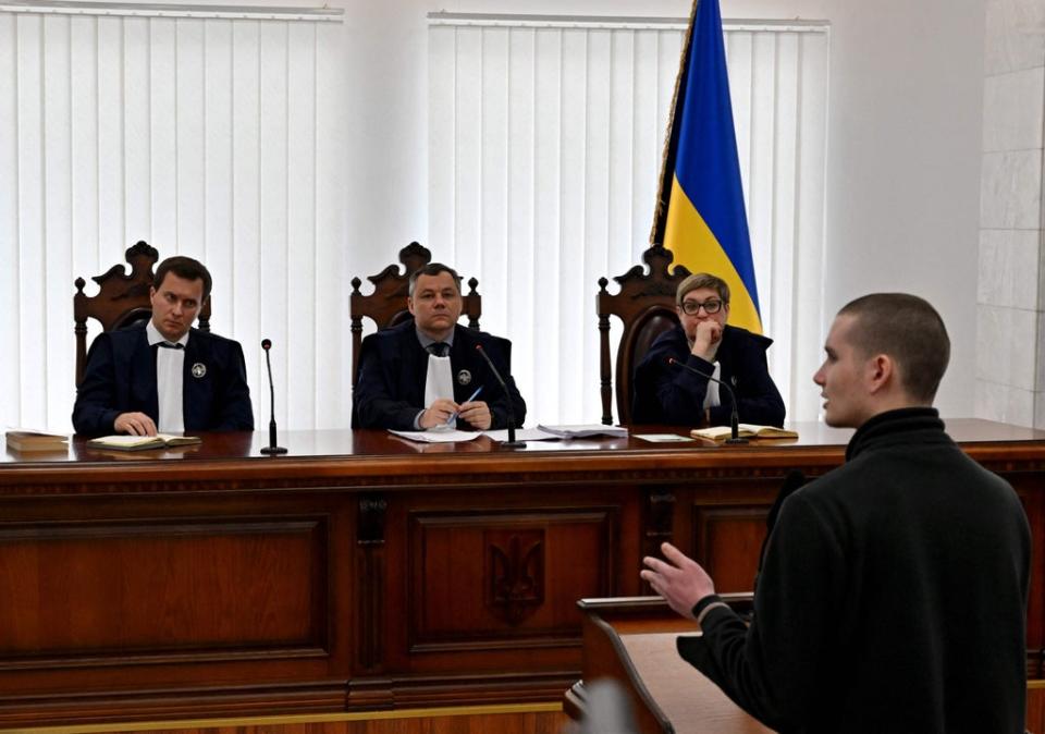 Captive Russian soldier Ivan Matysov (R) testifies on charges against Russian soldier, Vadim Shishimarin of war crimes for killing a civilian, at a courthouse in Kyiv on May 19, 2022 (AFP via Getty Images)