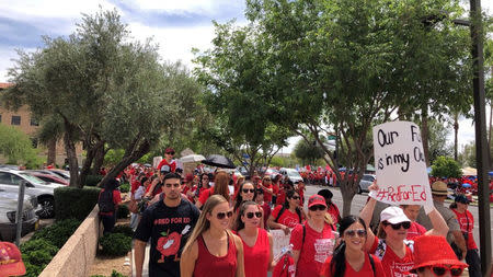 Participants take part in a march in Phoenix, Arizona, U.S., April 30, 2018 in this picture obtained from social media. Twitter/@MR_GEARING/via REUTERS.