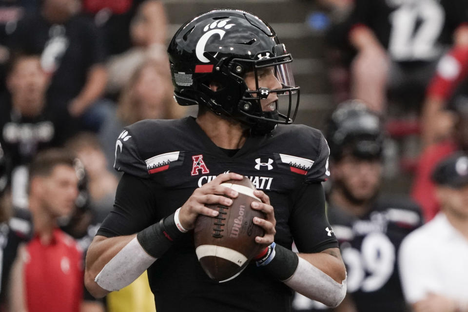 Cincinnati quarterback Desmond Ridder drops back for a pass during the second half of an NCAA college football game against Miami (Ohio), Saturday, Sept. 4, 2021, in Cincinnati. (AP Photo/Jeff Dean)