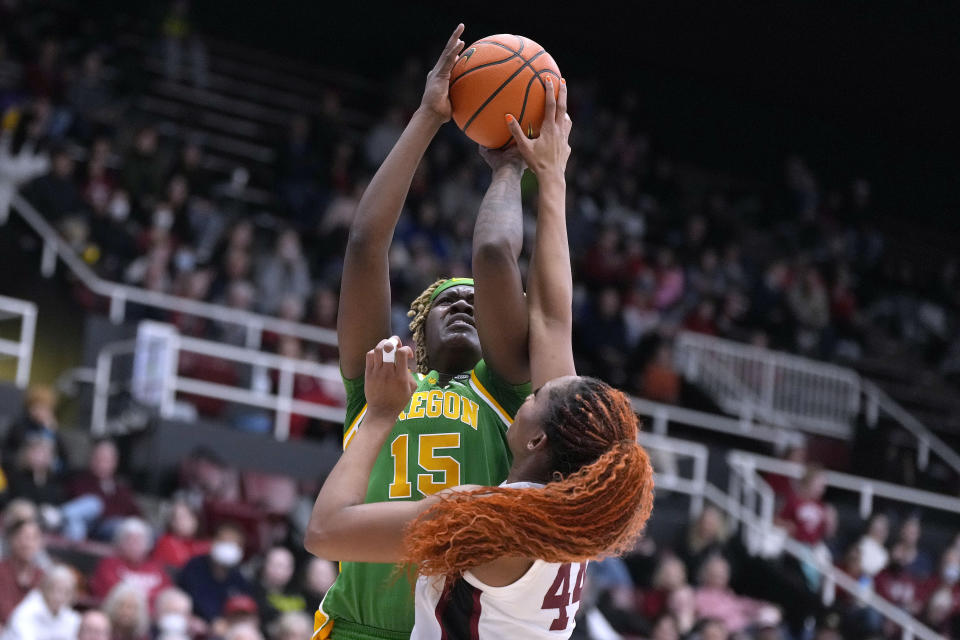 Stanford forward Kiki Iriafen (44) blocks a shot by Oregon center Phillipina Kyei (15) during the first half of an NCAA college basketball game Friday, Jan. 19, 2024, in Stanford, Calif. (AP Photo/Tony Avelar)