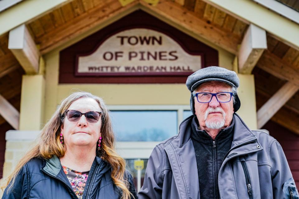 Cathi Murray and Larry Jensen outside Whitey Wardean Hall in the Town of Pines. The town hall and surrounding playground were built on coal ash fill, which a recent EPA report found poses a risk of cancer higher than previously known.