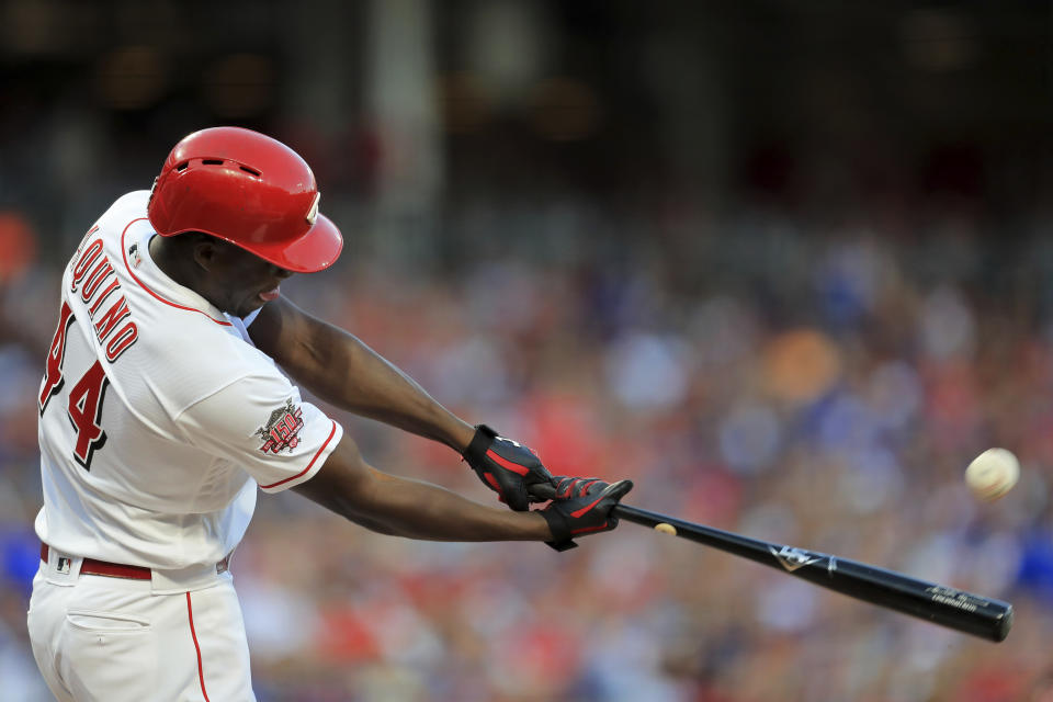 Cincinnati Reds' Aristides Aquino hits a solo home run, his second home run of the game, in the third inning of a baseball game against the Chicago Cubs, Saturday, Aug. 10, 2019, in Cincinnati. (AP Photo/Aaron Doster)