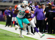 <p>Kenyan Drake #32 of the Miami Dolphins is tackled with the ball by Eric Kendricks #54 of the Minnesota Vikings int he second quarter of the game at U.S. Bank Stadium on December 16, 2018 in Minneapolis, Minnesota. (Photo by Adam Bettcher/Getty Images) </p>