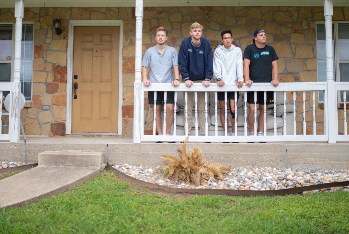 Ethan Tan, center right, and his roommates stand for a portrait on their front porch in College Station, Texas on Wednesday, April 23, 2024.