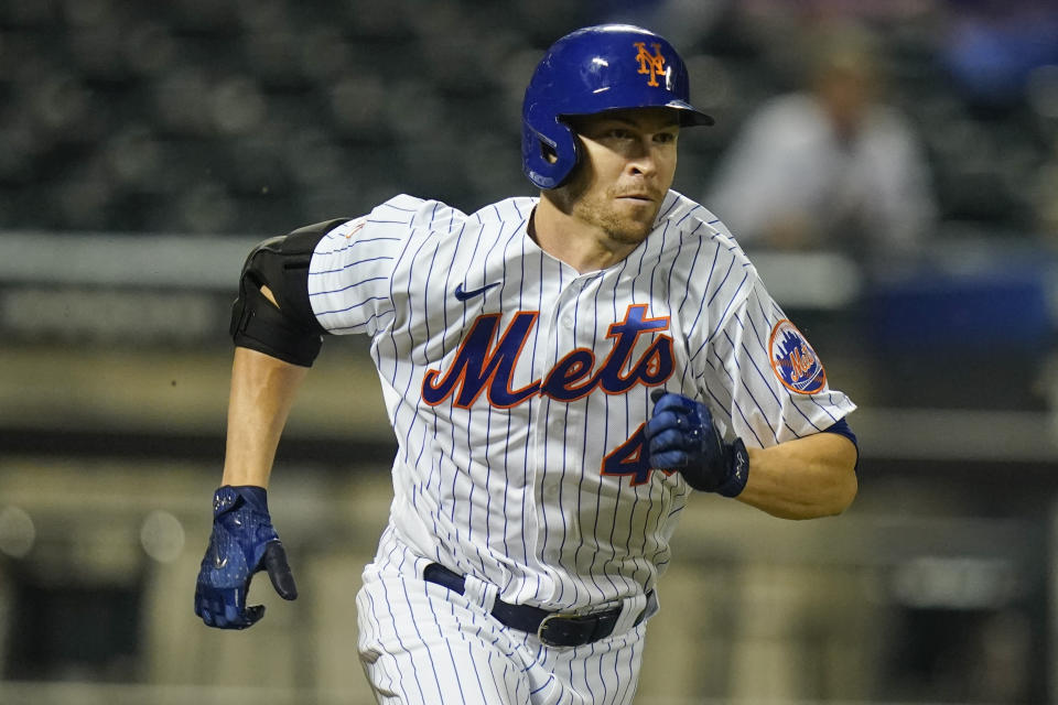 New York Mets' Jacob deGrom runs to first base for a single during the fifth inning of a baseball game against the Boston Red Sox Wednesday, April 28, 2021, in New York. (AP Photo/Frank Franklin II)