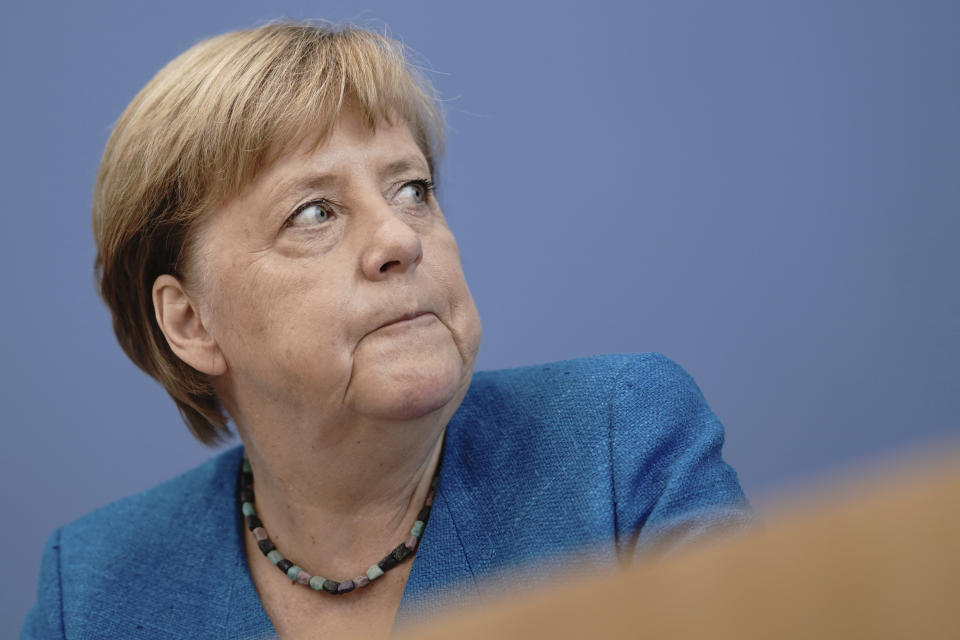 Chancellor Angela Merkel reacts to the media at the Federal Press Conference during her traditional summer press conference on current domestic and foreign policy issues in Berlin, Germany, Friday, Aug. 28, 2020. (Michael Kappeler/Pool via AP)