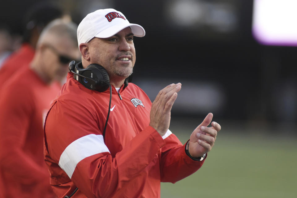 UNLV Head Coach Tony Sanchez encourages his team against Vanderbilt in the second half of an NCAA college football game Saturday, Oct. 12, 2019, in Nashville, Tenn. (AP Photo/Mike Strasinger)