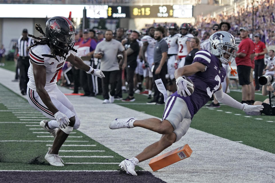 Kansas State wide receiver RJ Garcia II, right, is pushed out of bounds by Southeast Missouri State defensive back Lawrence Johnson after scoring a touchdown during the first half of an NCAA college football game Saturday, Sept. 2, 2023, in Manhattan, Kan. (AP Photo/Charlie Riedel)